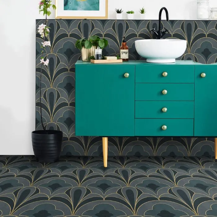 Bold art deco tiles contrast with a vibrant green vanity