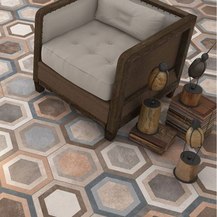 Living room with beige armchair and mixed colour hexagon floor tiles