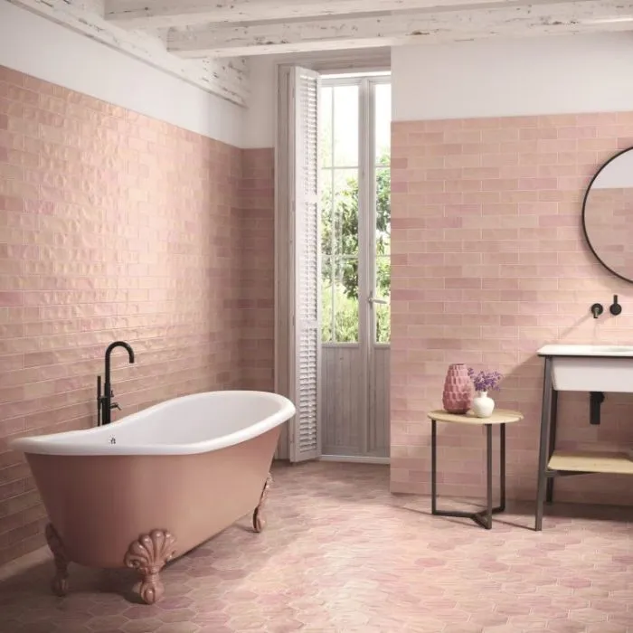 Chic pink tiled bathroom with a bathtub