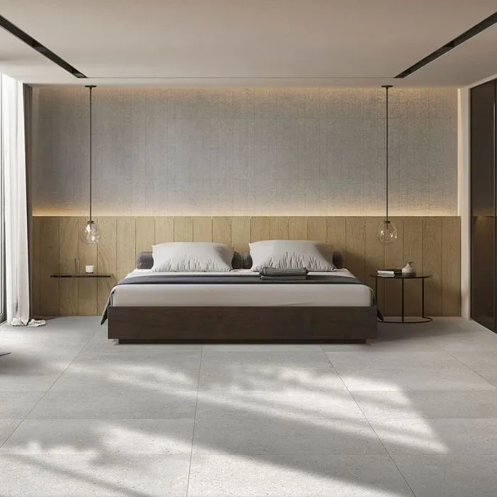 Contemporary bedroom decor accented by large floor tiles