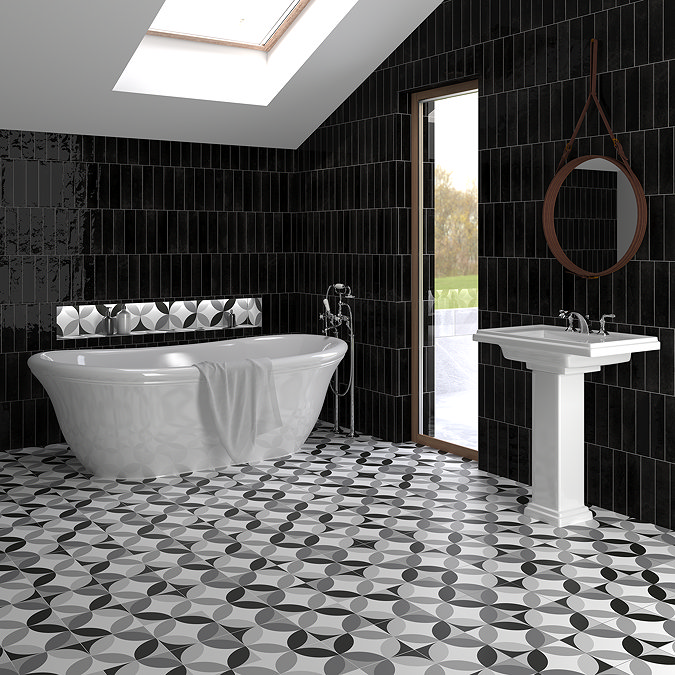 Classic black and white tiled bathroom with a tub