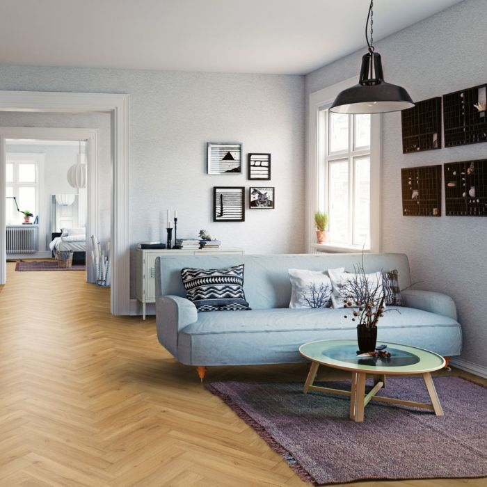 Spacious room with beautiful herringbone wooden floors