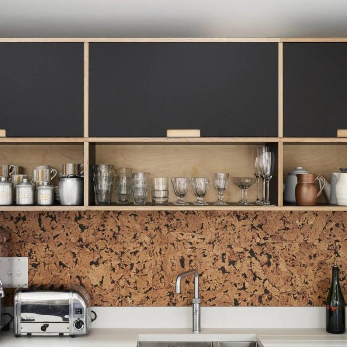 Kitchen with cork splashback tiles, adding a unique touch to the décor