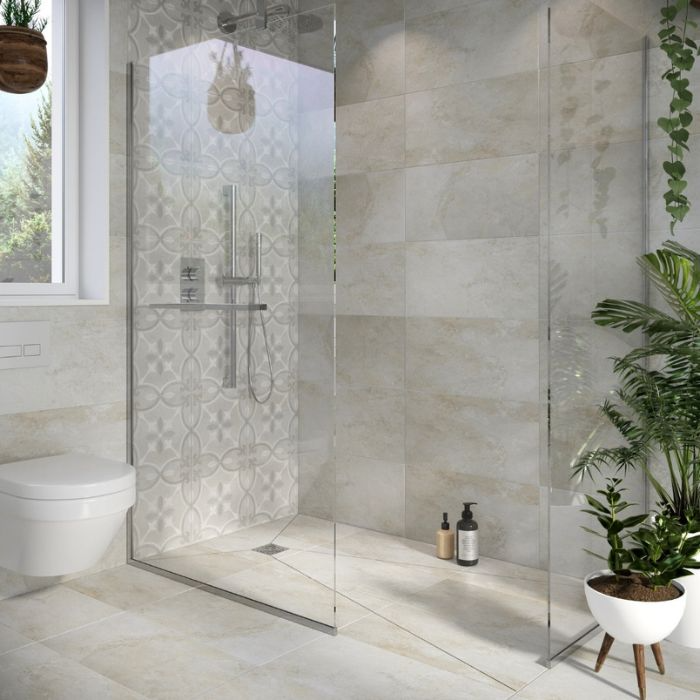 Serene bathroom setting featuring a sleek glass shower enclosure and greenery