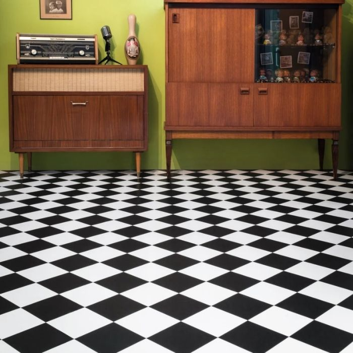 Black and white tiles form a chic checkered pattern on the floor 