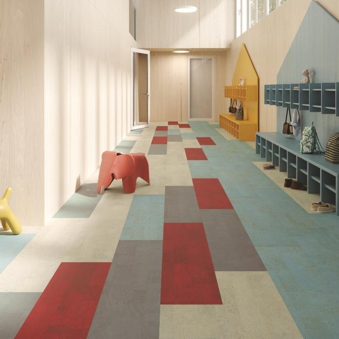 A bright hallway in a children's room featuring colorful wooden flooring