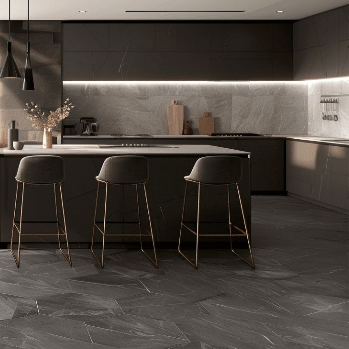 Stylish black and white kitchen with bar stools against intricate hexagon tiled floor