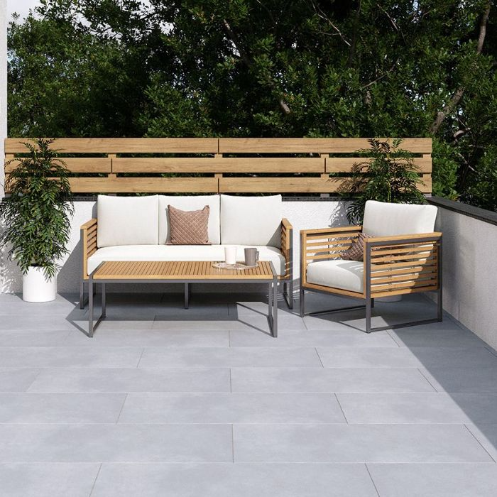 Relaxing outdoor seating area on grey tiled patio