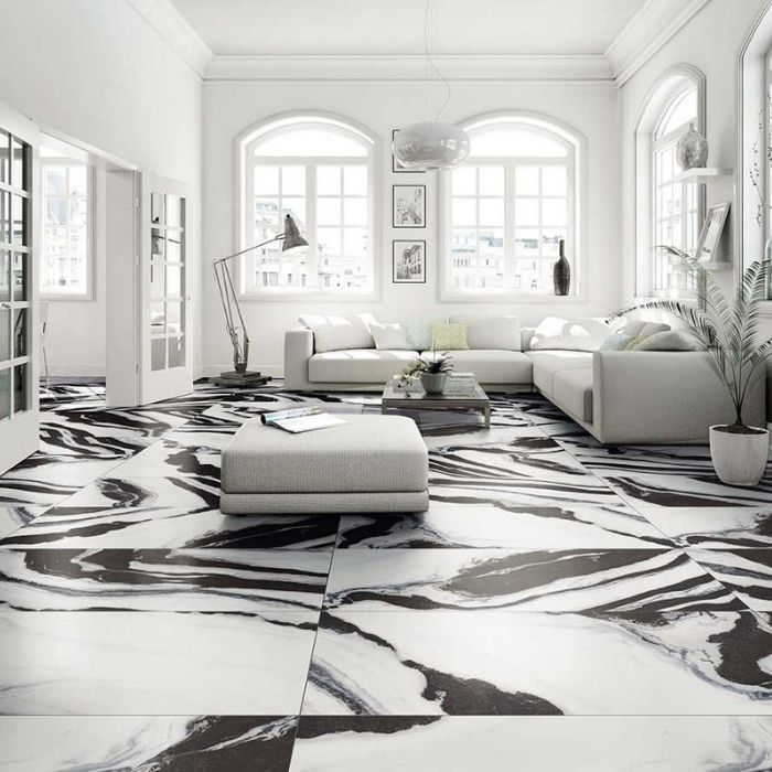 Elegant black and white marble floor graces a stylish living room