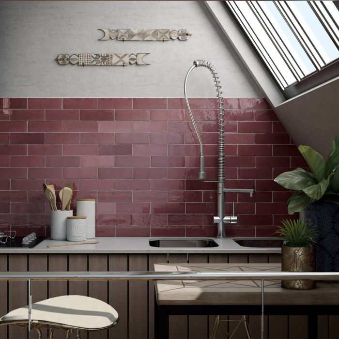 Modern kitchen design featuring unique red brick tiling