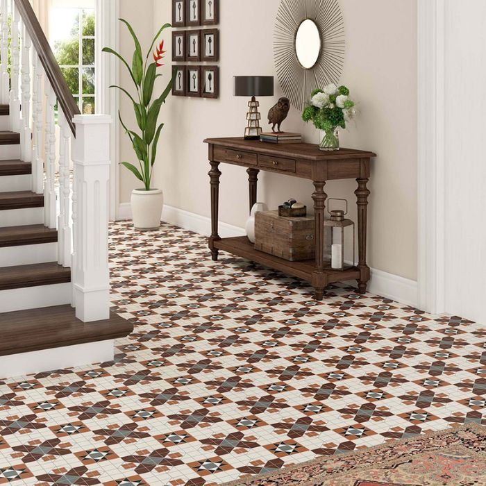 Refined hallway with patterned floor tiles and a cosy rug