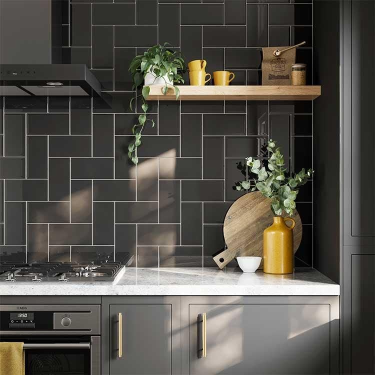 Elegant kitchen design featuring yellow accents on dark tiled backsplash