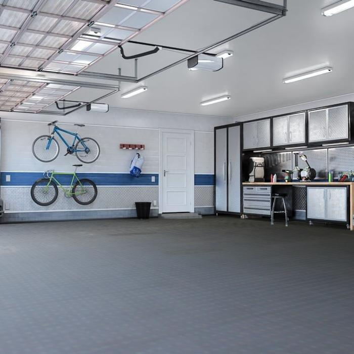 An organised garage with a bike rack, set on a smooth concrete floor