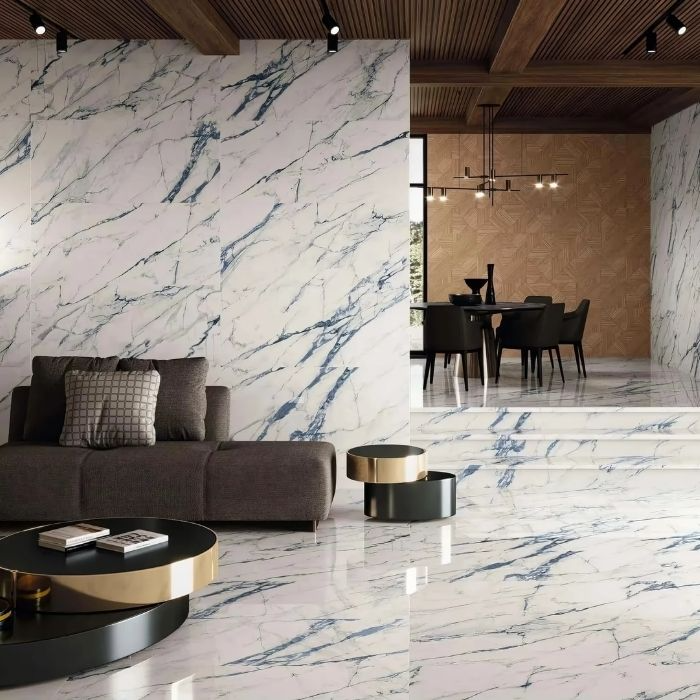 Living room with white marble tiles featuring blue veining