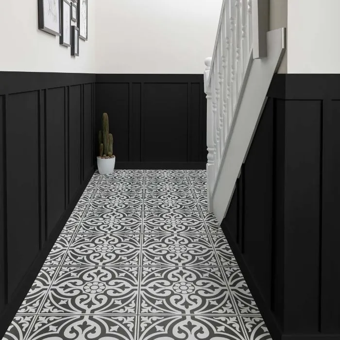 A visually captivating hallway with black and white tile flooring