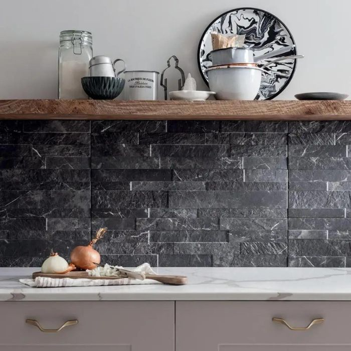 Monochrome kitchen with striking black stone effect backsplash