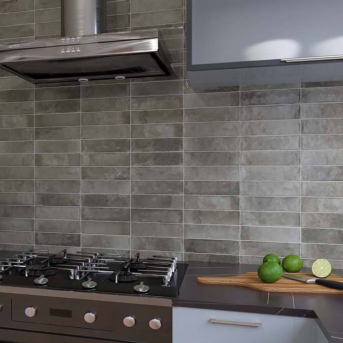 Modern kitchen with grey subway wall tiles and sleek stove