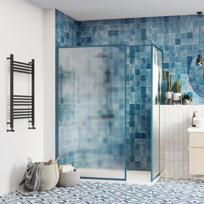 Modern blue tiled bathroom with sleek glass shower door