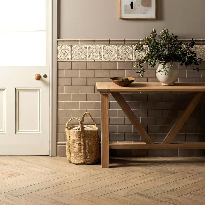 A wooden bench sits invitingly in a tiled hallway, showcasing a blend of textures