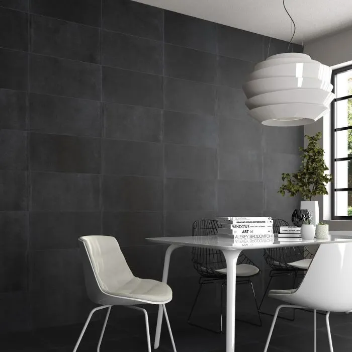 Monochrome dining area with anthracite tile designs for walls