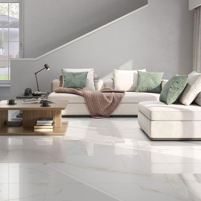 Modern lounge showcasing luxurious marble tiles and bright white sofas