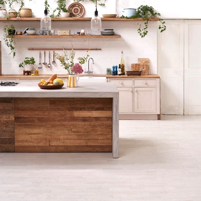 Modern kitchen with white cork flooring and wooden island