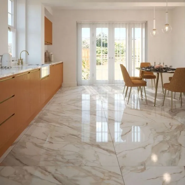 Spacious kitchen with sleek marble flooring and a stylish dining area