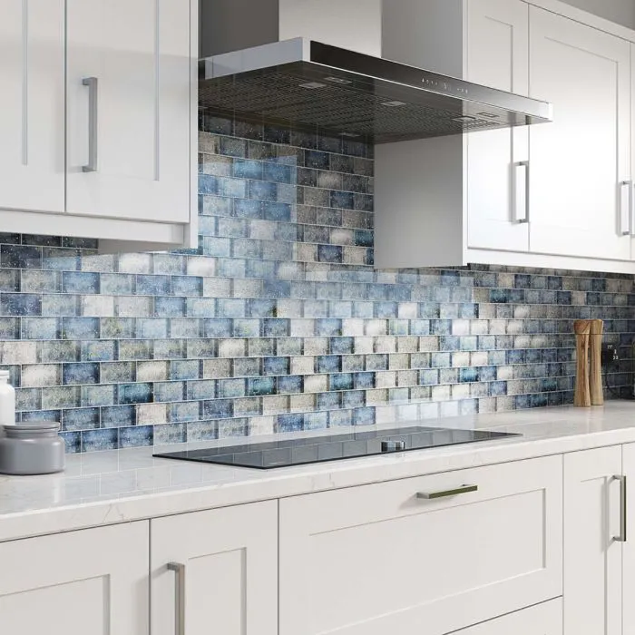 Charming blue and white mosaic tile backsplash in a modern kitchen