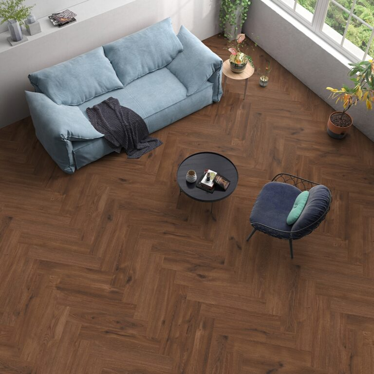 Modern living space featuring wooden herringbone flooring and a vibrant blue sofa