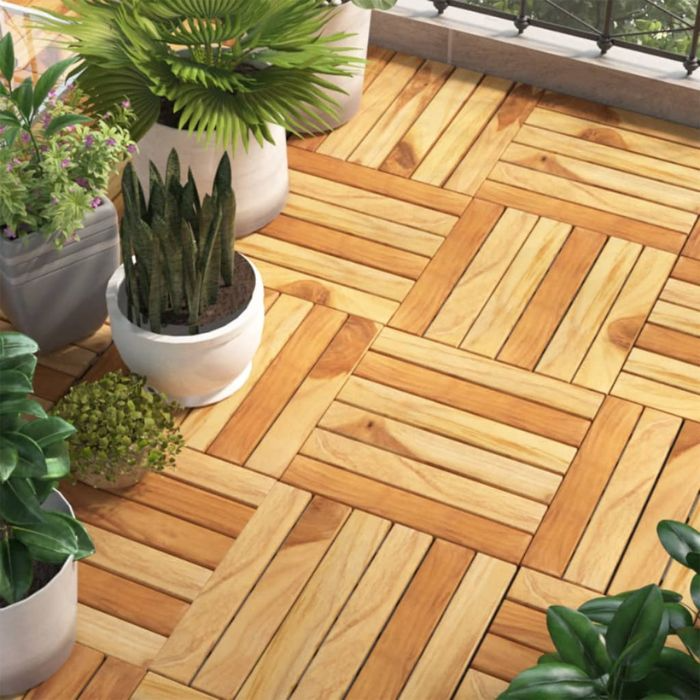 Vibrant green plants and potted flowers on a wooden deck