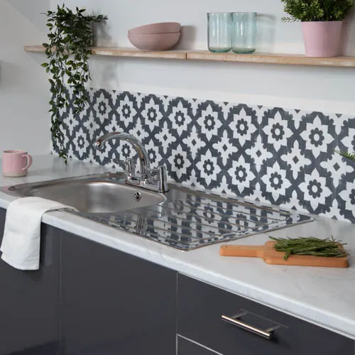 Monochrome kitchen with bold vinyl decal backsplash