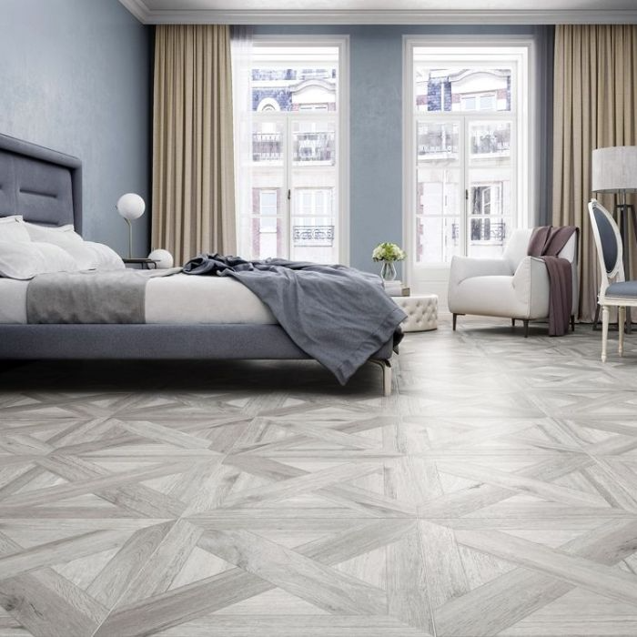 Blue and white bedroom with a serene and inviting ambiance, featuring elegant grey wood tiles