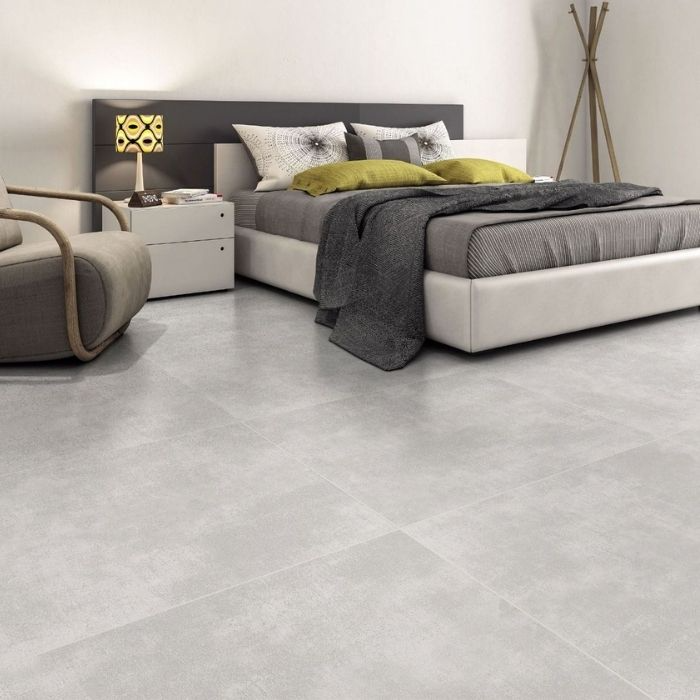 Modern living room showcasing a striking grey concrete-effect flooring