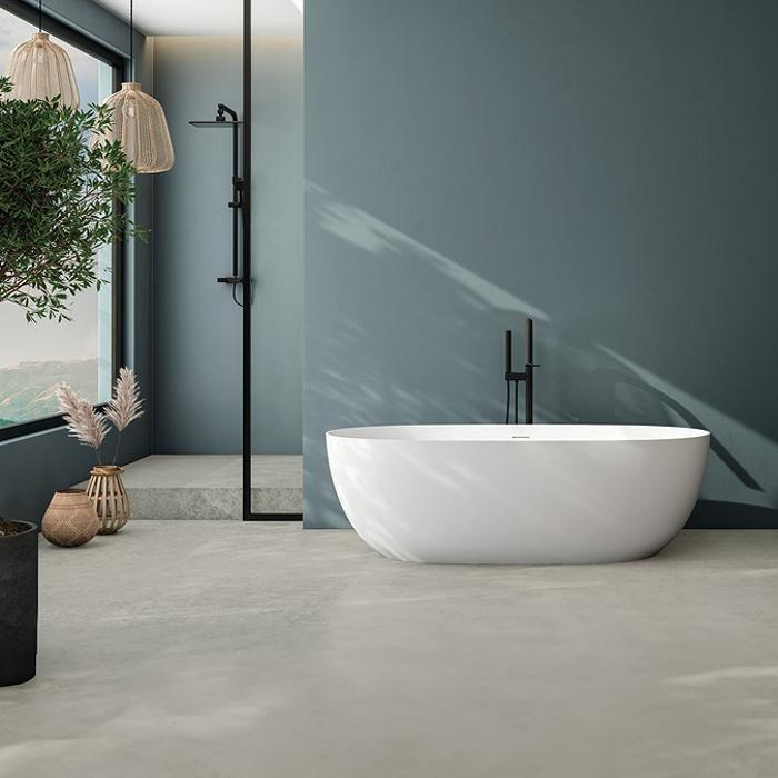 Modern freestanding bath with concrete floor tiles