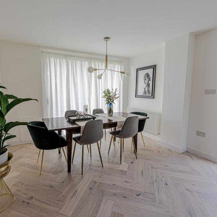 Dining room with light parquet flooring