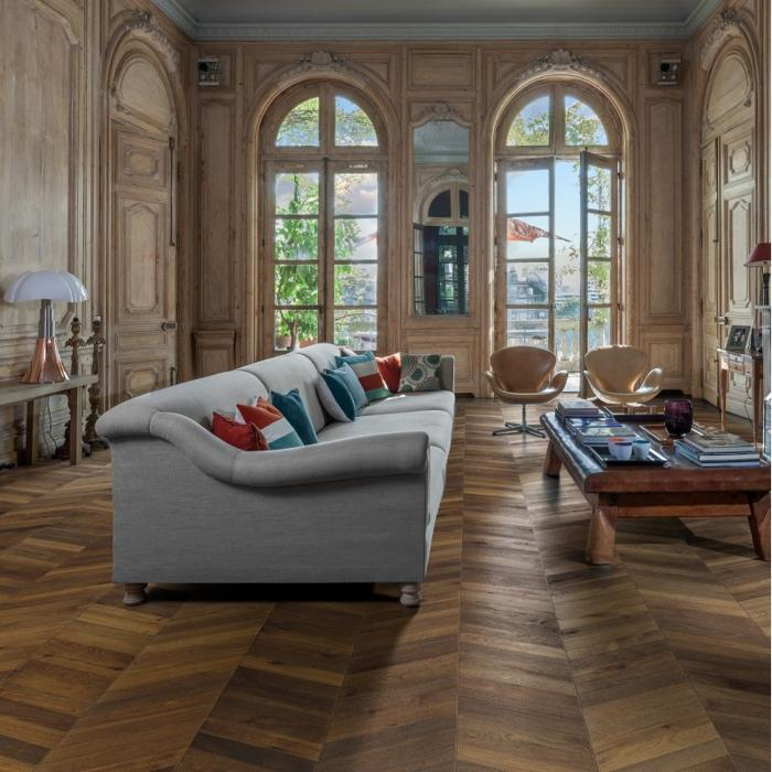 Elegant living room with chevron wood flooring