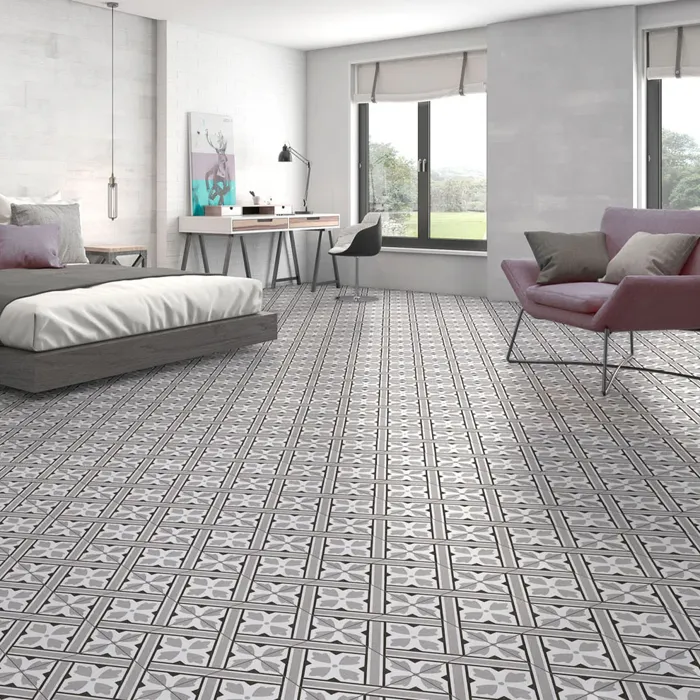 Black and white patterned tiles in spacious bedroom