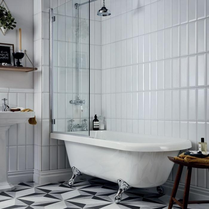 Monochrome bathroom lined with geometric floor tiles