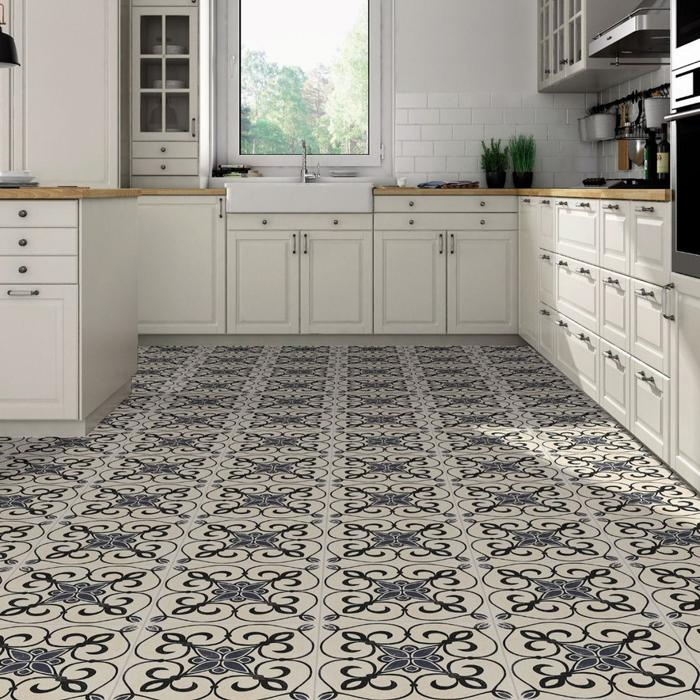 Greyscale ornate tiles in bright kitchen