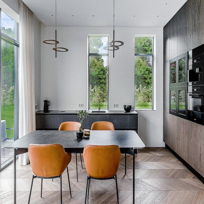 Contemporary kitchen with chevron wood flooring