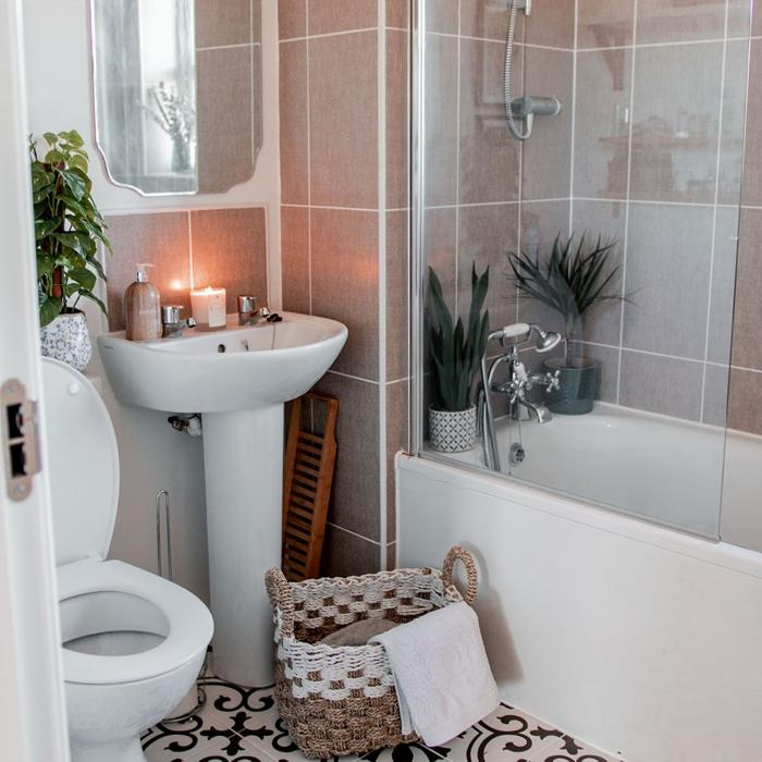 Small bathroom featuring intricate floor tiles