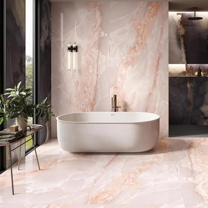 Modern bathtub with pink onyx tile walls and flooring