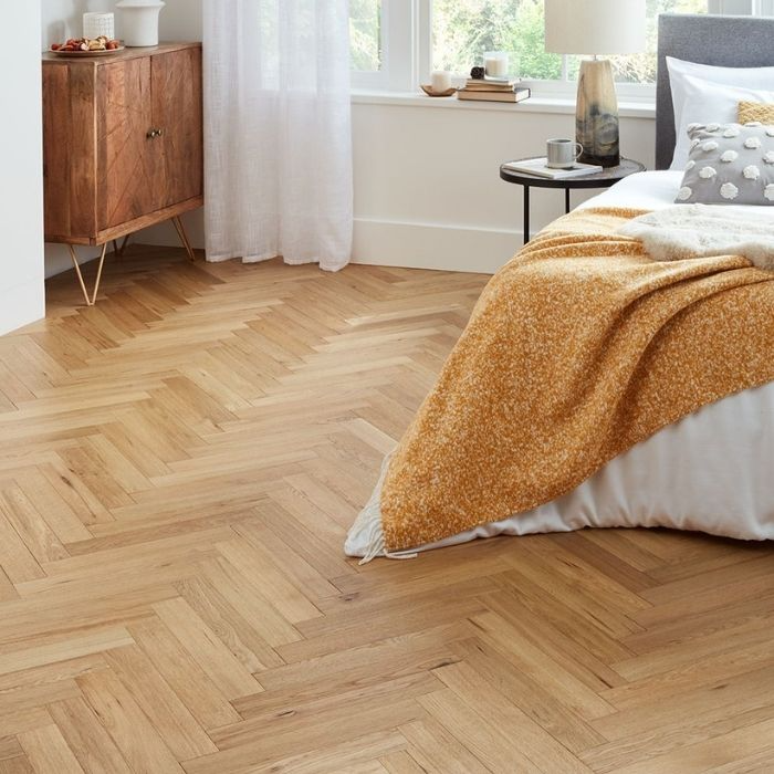 Cosy bedroom with oak herringbone flooring