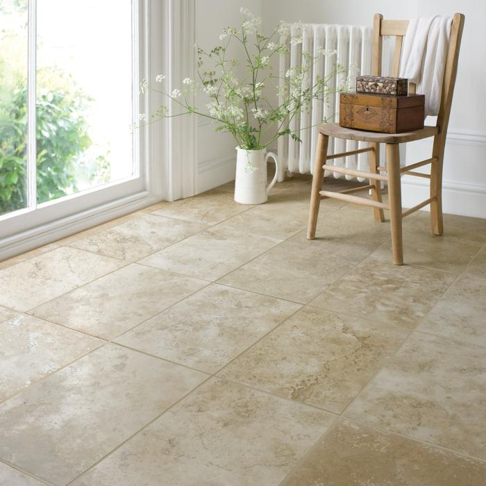 Wooden chair on travertine tiled floor