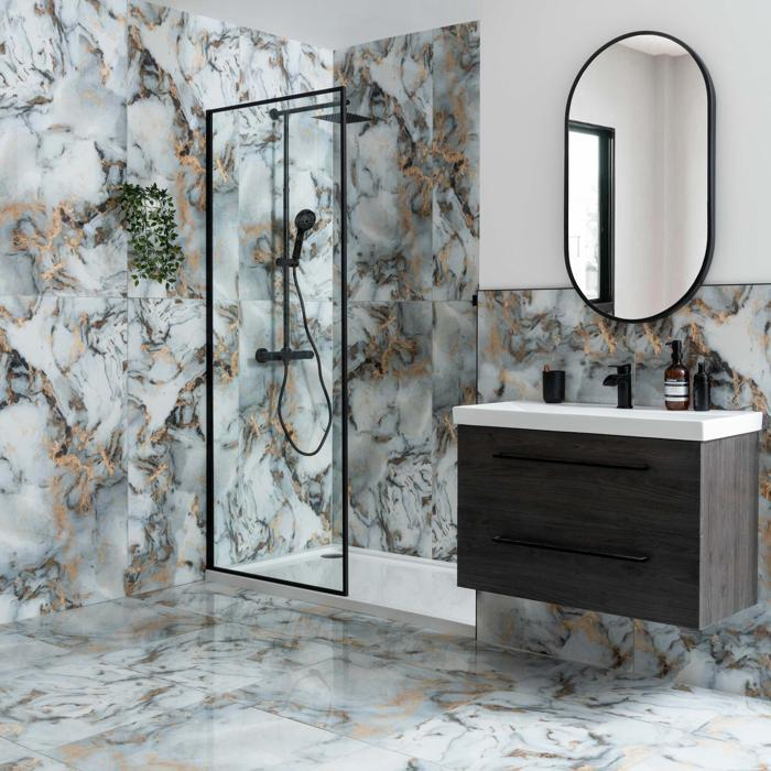 Bathroom with vibrant black and gold marble effect tiles