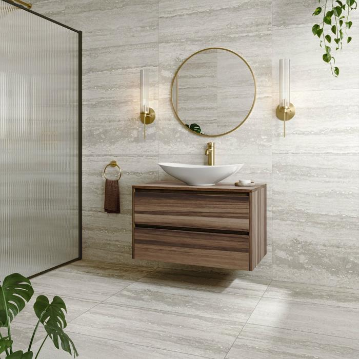 Floating vanity in travertine-tiled bathroom