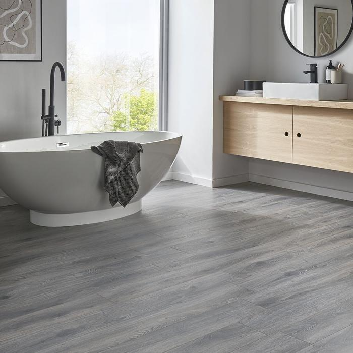 Grey wood grain tiles in a minimalist bathroom