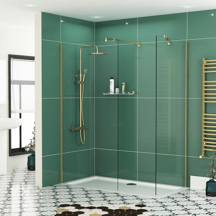 Green-tiled walk-in shower with brass fixtures