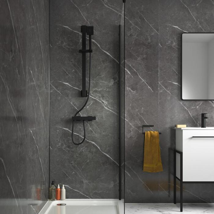 Black marble wall panels in a modern shower room