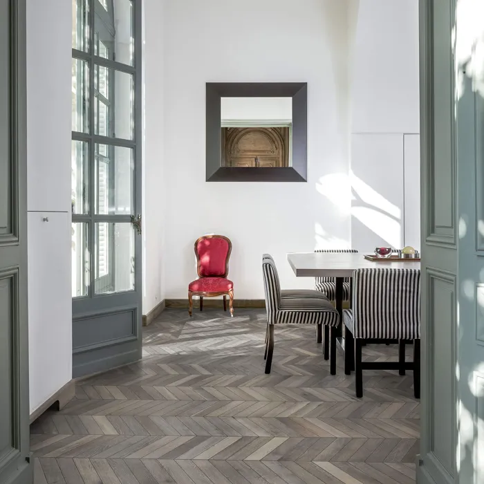 Bright dining room with grey chevron flooring